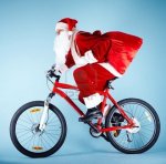 11236386-foto-de-santa-claus-con-saco-rojo-montando-bicicleta.jpg