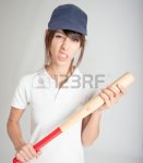 10953923-young-woman-with-a-baseball-bat-and-a-mean-expression.jpg