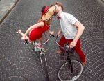 coupleinred_on_bikes.jpg