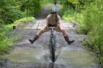 Tanglefoot-Moonshiner-v2-rigid-steel-dropbar-mountain-bike_Kat-playing-in-puddles-800x533.jpg